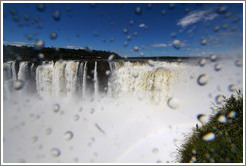 Spray from the Iguazu Falls at Garganta del Diablo, with a rainbow.