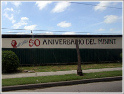 Words painted on a wall: "50 Aniversario del MININT" (Cuba's Ministry of the Interior). Calle Perla, La V&iacute;bora neighborhood.