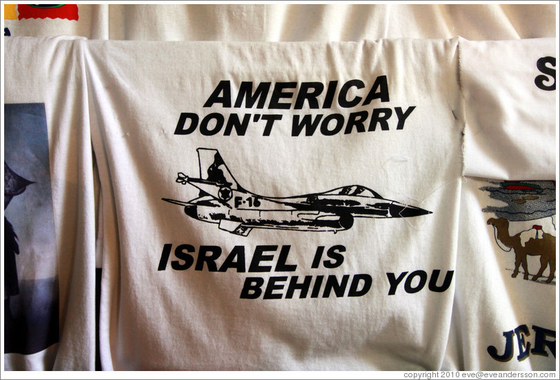 Shirt for sale in the souk; it reads, "America don't worry / Israel is behind you."