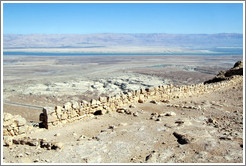 Eastern wall, desert fortress of Masada, with a view of the Dead Sea in the background.