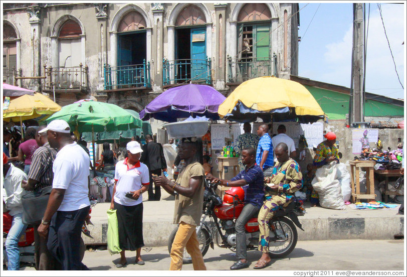 People and umbrellas. Lagos Island.