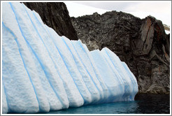 Blue iceberg and granite rocks.