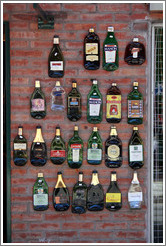 Flattened bottles on a wall. Russel, Palermo Soho.