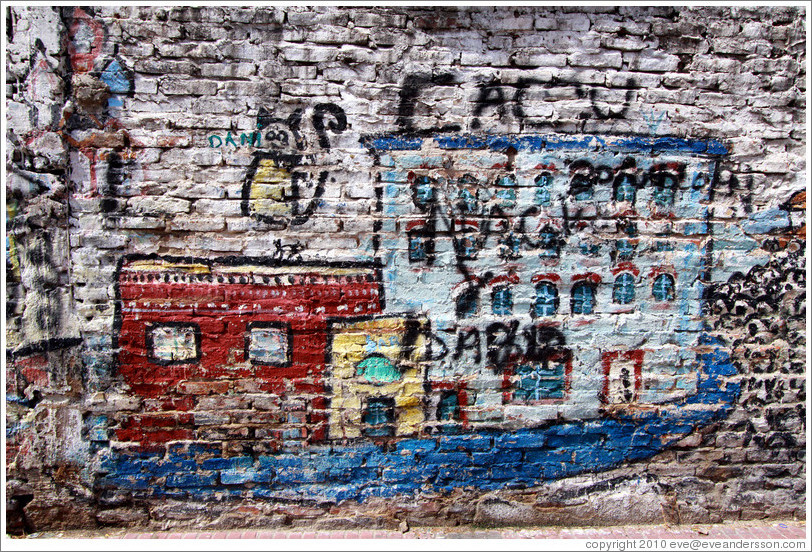 Graffiti (buildings and a floating cat), Calle Defensa and Avenida Independencia, San Telmo district.