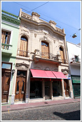 Calle Defensa near Avenida Carlos Calvo, San Telmo district.