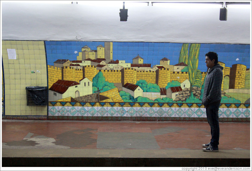 Man in front of a mural, Diagonal Norte station, Subte (Buenos Aires subway).