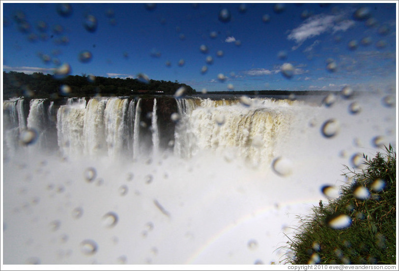 Spray from the Iguazu Falls at Garganta del Diablo, with a rainbow.