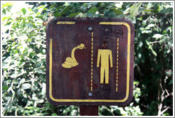 Sign showing a snake and a headless man, path to Garganta del Diablo.