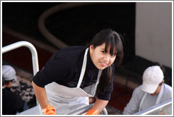 Woman putting grapes into boxes. Bodegas Etchart.