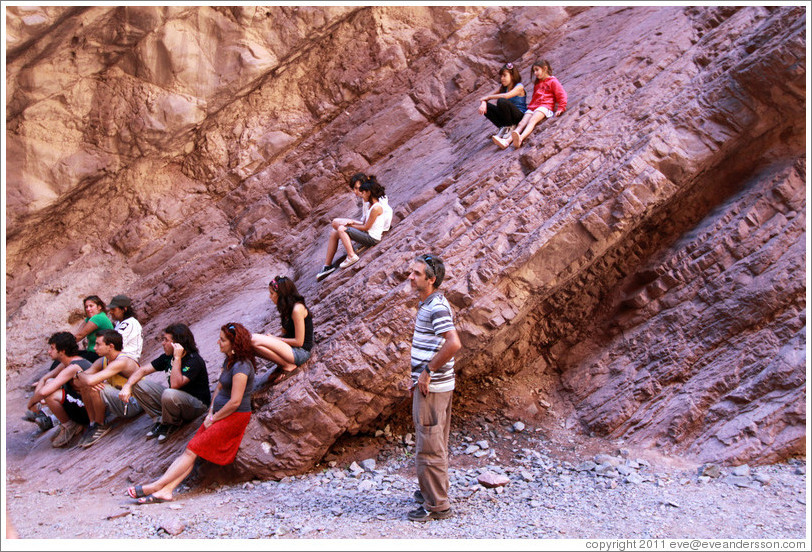 People resting. El Anfiteatro (The Ampitheatre), a natural rock formation. Quebrada de las Conchas.