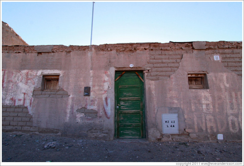 Building with green door.