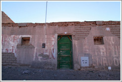 Building with green door.