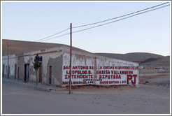 Building with a political advert painted on the side.