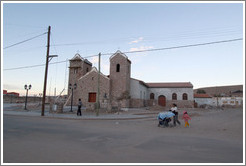 Church with a family walking by.