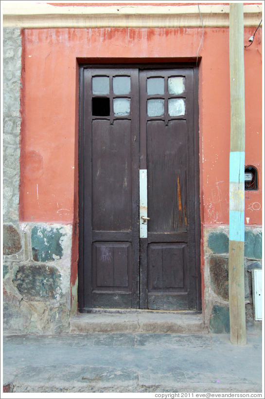 Door in an orange building.