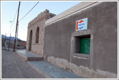 Window with Pepsi sign.