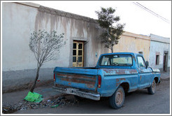 Blue pickup truck.