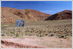 Sign for La Polvorilla viaduct, 4200 meters of altitude, 64 meters high and 224 meters long.