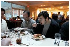 ArsDigita Thanksgiving 1999.  Rolf astounded by Brian's eating habits.