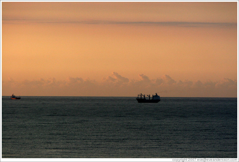 Boat seen from Ipanema at sunrise.