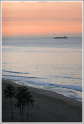 Ipanema Beach at sunrise.  Palm trees and boat.