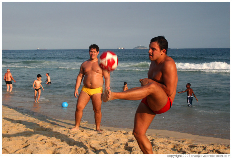 Man playing soccer on Ipanema Beach.