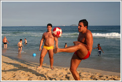 Man playing soccer on Ipanema Beach.