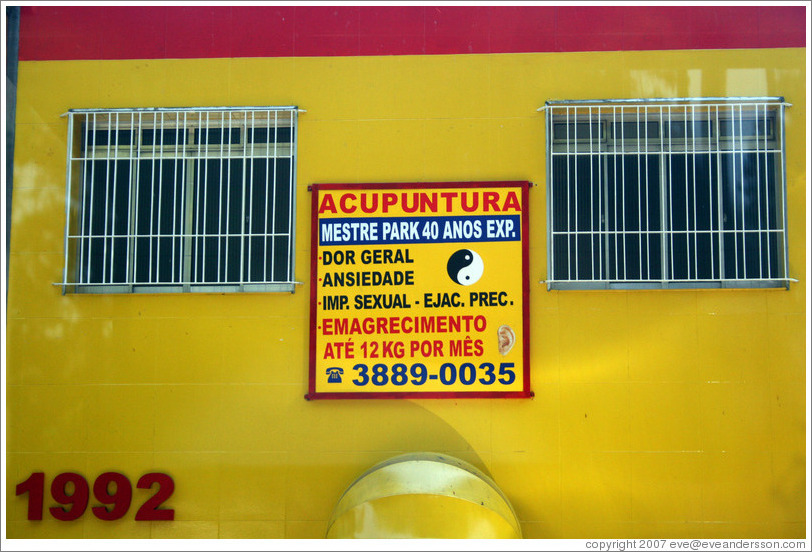 Sign advertising acupuncture as a cure for  impotence and premature ejaculation.