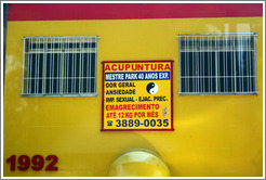 Sign advertising acupuncture as a cure for  impotence and premature ejaculation.