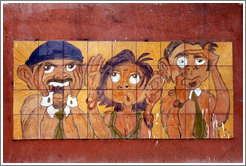 Artwork: three people.  Wall surrounding the Cemit?o S?Paulo.
