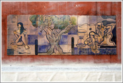 Artwork: woman, tree, hourglass, man.  Wall surrounding the Cemit?o S?Paulo.