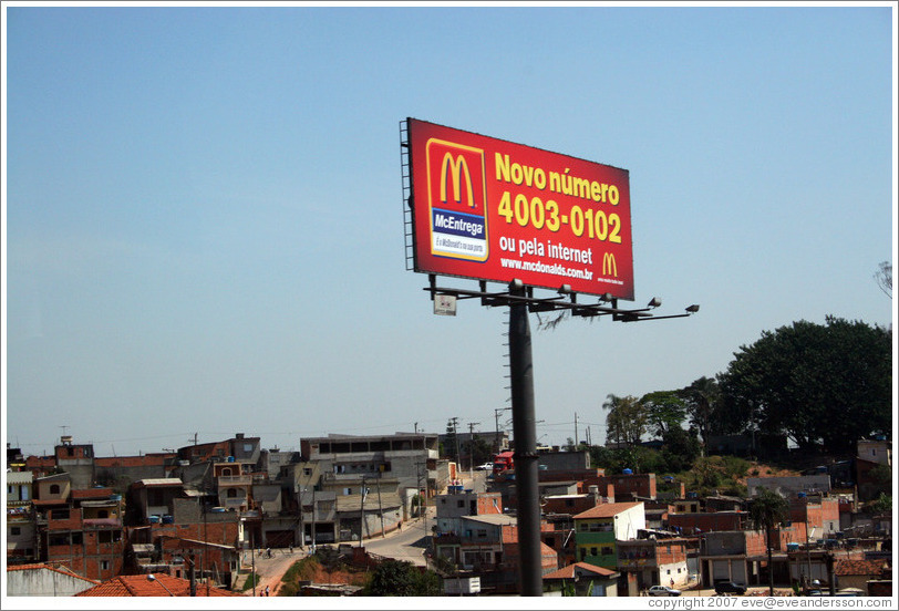 Billboard advertising McDonald's in front of a favela near S&atilde;o Paulo.