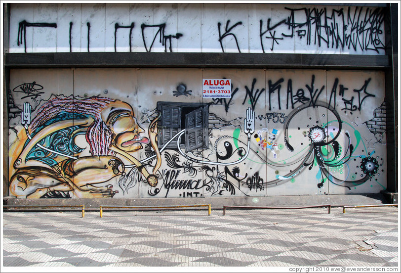 Graffiti: smoking woman, hands with hearts.  Avenida Brigadeiro Faria Lima at Rua Tucum