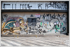 Graffiti: smoking woman, hands with hearts.  Avenida Brigadeiro Faria Lima at Rua Tucum