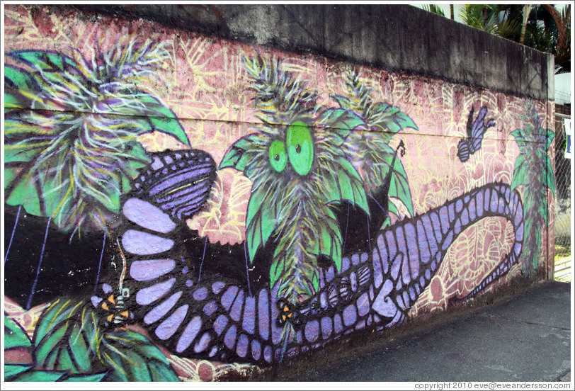 Graffiti: purple lizard and green plant with eyes.  Av. Quarto Centen?o at Rua Leiria.