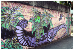 Graffiti: purple lizard and green plant with eyes.  Av. Quarto Centen?o at Rua Leiria.