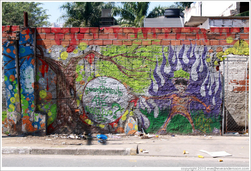 Graffiti: man with purple flames.  Rua Nova Cidade.