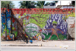 Graffiti: man with purple flames.  Rua Nova Cidade.
