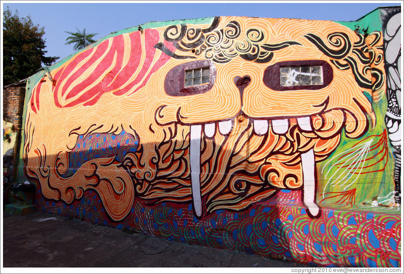 Graffiti: creature with long teeth and windows for eyes.  Villa Magdalenda neighborhood.  Alley between Rua Padre Jo?Gon?ves and Rua Belmiro Braga.