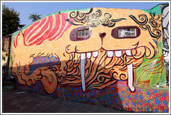 Graffiti: creature with long teeth and windows for eyes.  Villa Magdalenda neighborhood.  Alley between Rua Padre Jo?Gon?ves and Rua Belmiro Braga.
