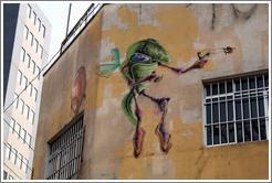 Graffiti: flying green insect with slingshot.  Villa Magdalenda neighborhood.  Rua Belmiro Braga and Rua Cardeal Arcoverde.