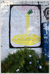 Graffiti: yellow liquid pouring out of two plastic bottles.  The bottles are real.  Villa Magdalenda neighborhood.  Playground on Rua Belmiro Braga.