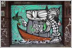 Graffiti: creatures in a boat holding a house with a green sun and sky behind.  Villa Magdalenda neighborhood.  Rua Cardeal Arcoverde.