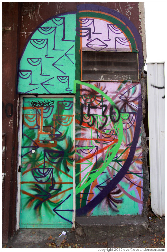 Graffiti: face containing many faces.  Villa Magdalenda neighborhood.  Rua Cardeal Arcoverde.