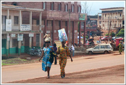 Women carrying bags on their heads.