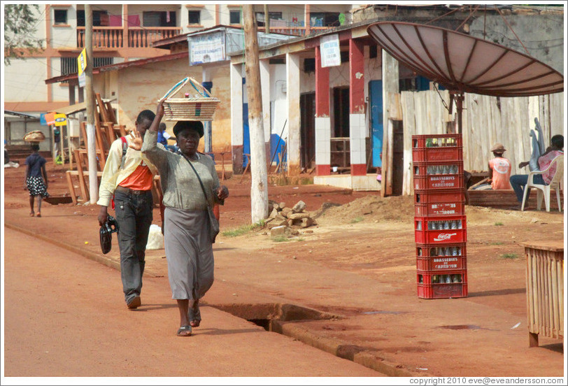 Pedestrians and a satellite dish.