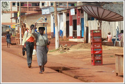 Pedestrians and a satellite dish.