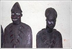 Wood carvings of two men.
