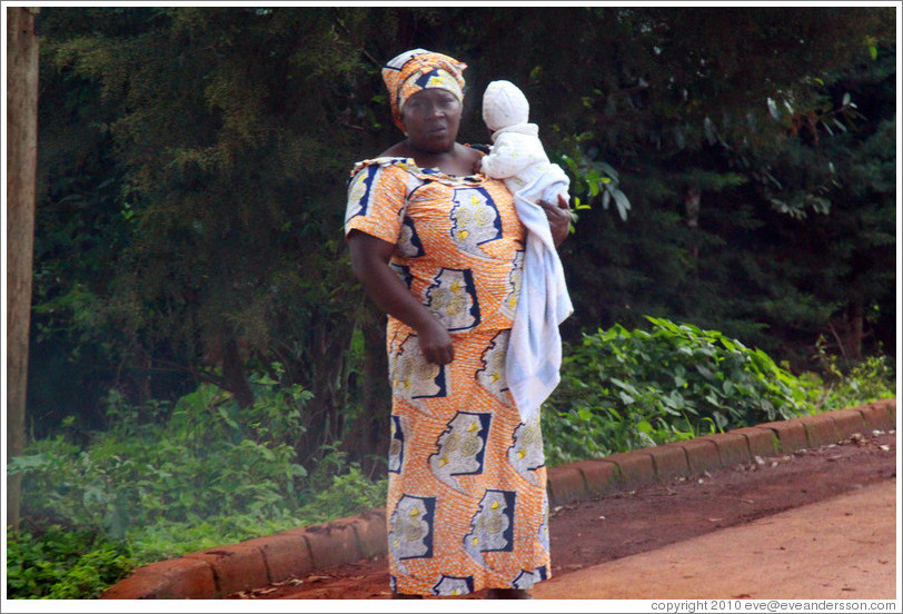 Woman holding baby.