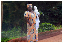 Woman holding baby.